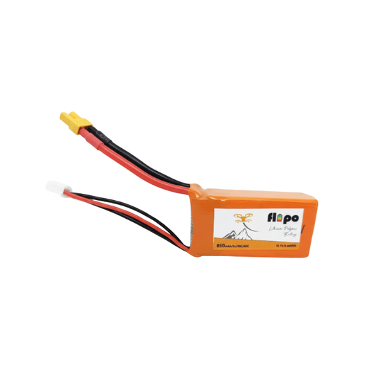 Orange battery with red and black wires on a white background