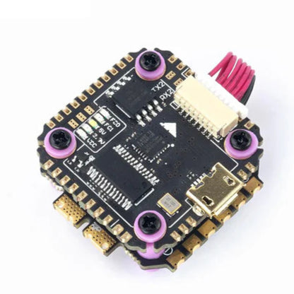 Electronic circuit board with gold and black components on a white background